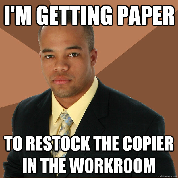 I'm getting paper to restock the copier in the workroom  Successful Black Man