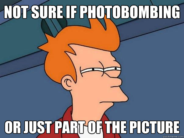 Not sure if photobombing Or just part of the picture  Futurama Fry