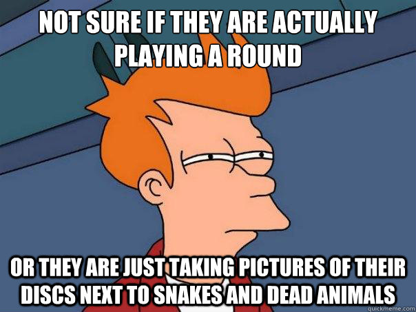 Not sure if they are actually playing a round Or they are just taking pictures of their discs next to snakes and dead animals  Futurama Fry