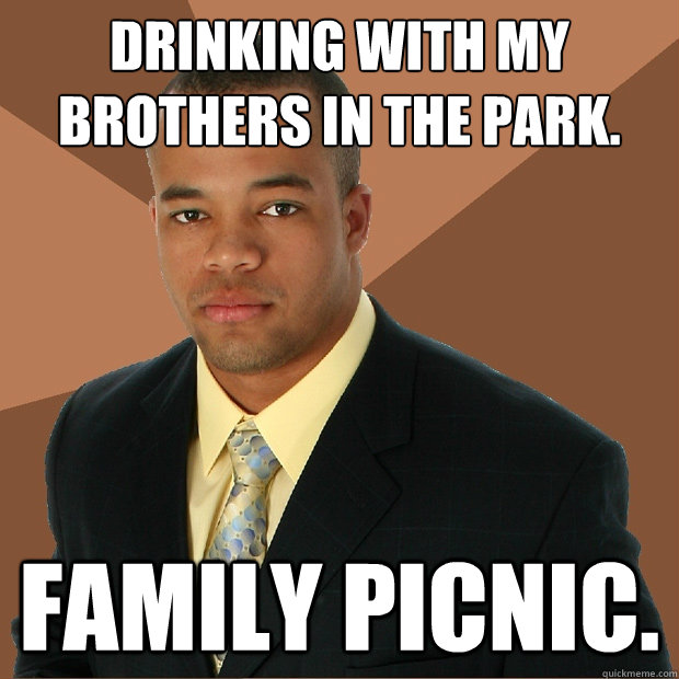 Drinking with my brothers in the park. family picnic.  Successful Black Man