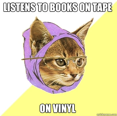 Listens to books on tape on vinyl  Hipster Kitty