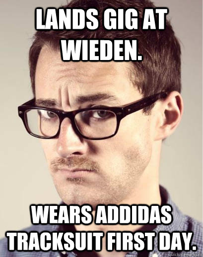 Lands gig at Wieden. Wears Addidas tracksuit first day.  Junior Art Director