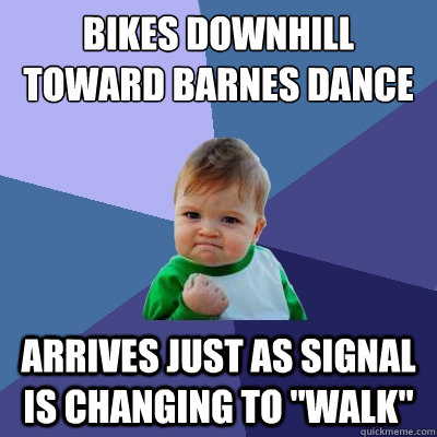 bikes downhill toward barnes dance arrives just as signal is changing to 