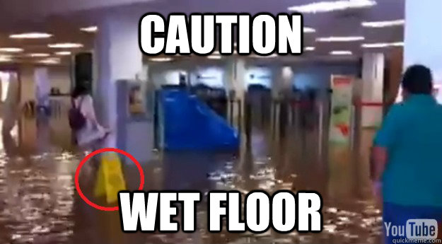 caution wet floor - caution wet floor  international CCU AIRPORT