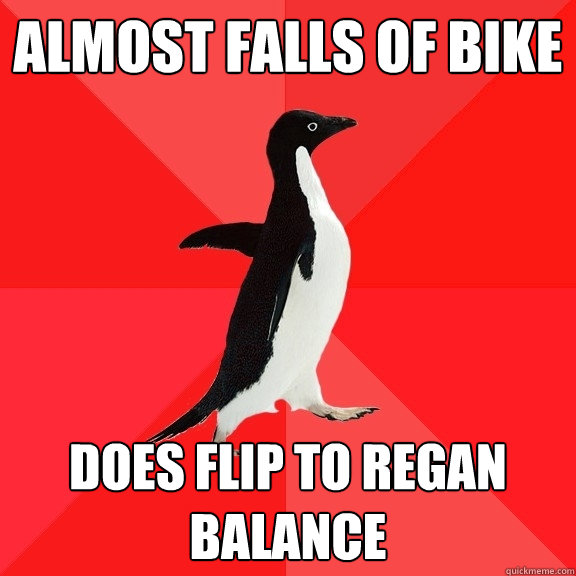 almost falls of bike does flip to regan balance  Socially Awesome Penguin