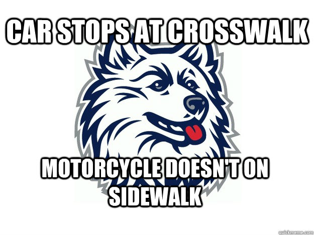 car stops at crosswalk motorcycle doesn't on sidewalk  