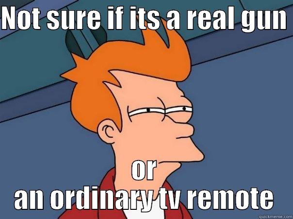 NOT SURE IF ITS A REAL GUN  OR AN ORDINARY TV REMOTE Futurama Fry