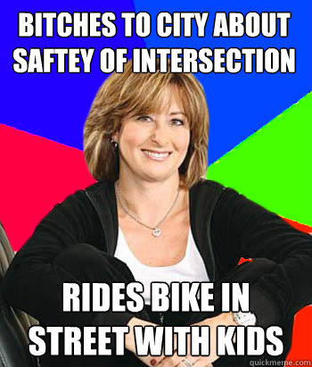 bitches to city about saftey of intersection rides bike in street with kids  Sheltering Suburban Mom