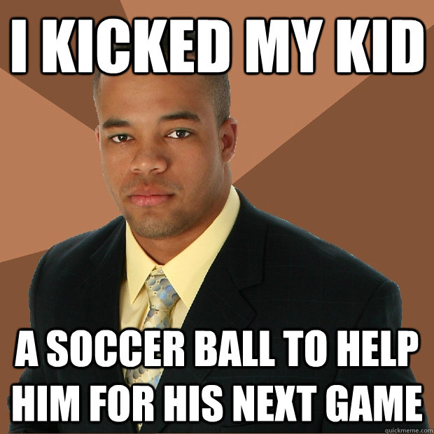 I kicked my kid a soccer ball to help him for his next game  Successful Black Man