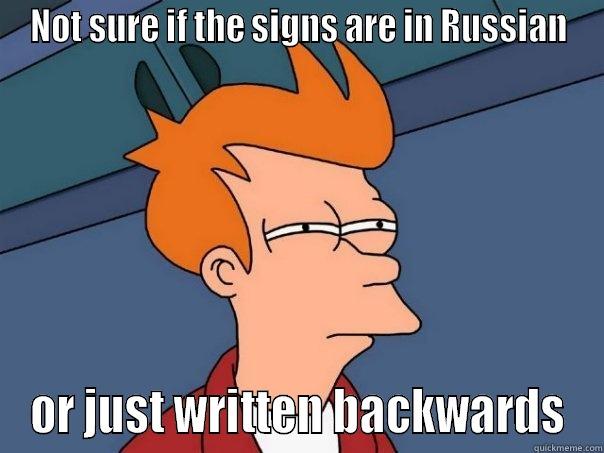 I've been watching a lot of Olympics recently - NOT SURE IF THE SIGNS ARE IN RUSSIAN OR JUST WRITTEN BACKWARDS Futurama Fry