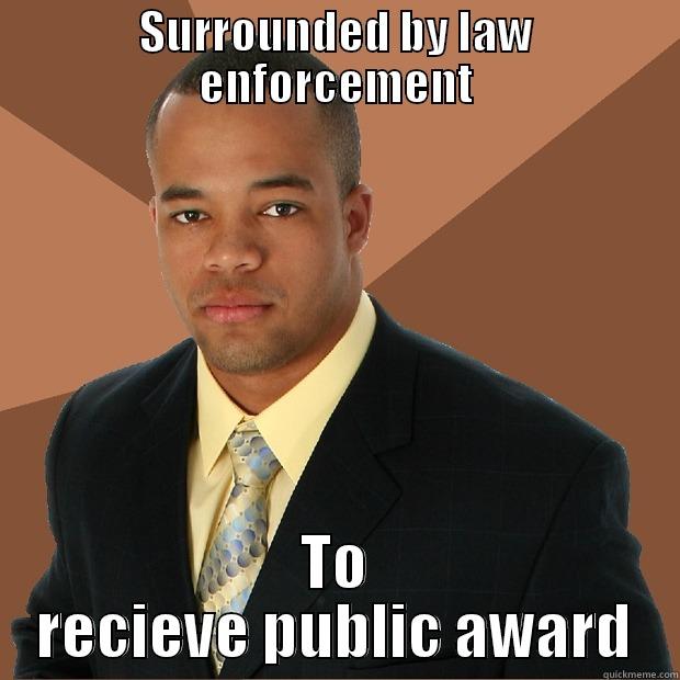 SURROUNDED BY LAW ENFORCEMENT TO RECIEVE PUBLIC AWARD Successful Black Man