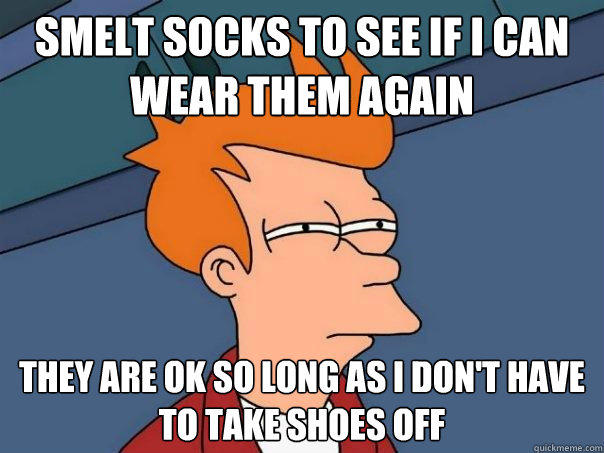 smelt socks to see if i can wear them again they are ok so long as i don't have to take shoes off  Futurama Fry