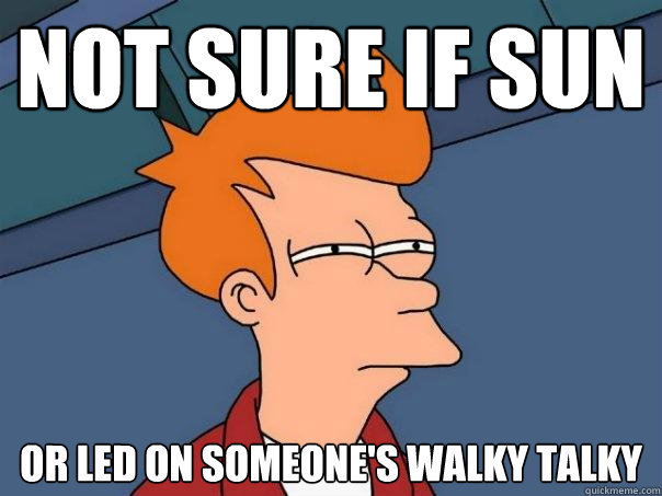 Not sure if sun or led on someone's walky talky  Futurama Fry