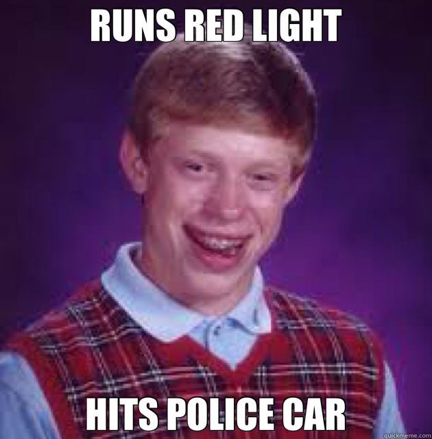 RUNS RED LIGHT HITS POLICE CAR  
