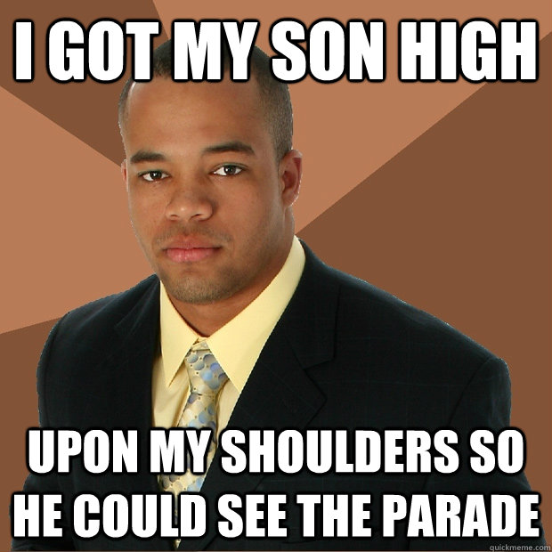 I got my son high upon my shoulders so he could see the parade  Successful Black Man