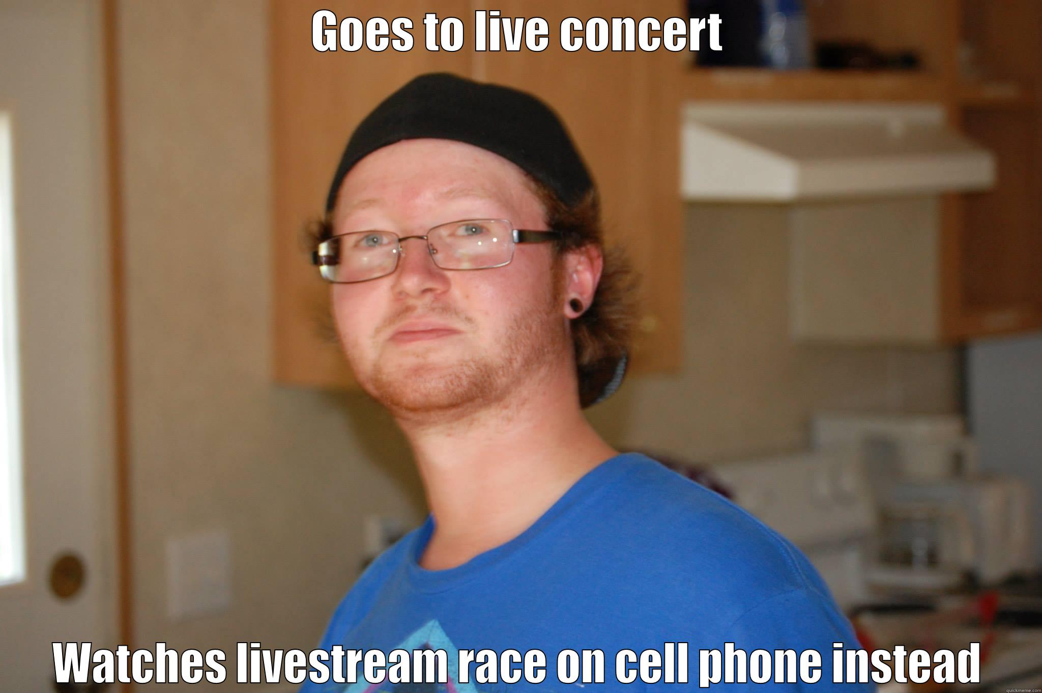 GOES TO LIVE CONCERT WATCHES LIVESTREAM RACE ON CELL PHONE INSTEAD Misc