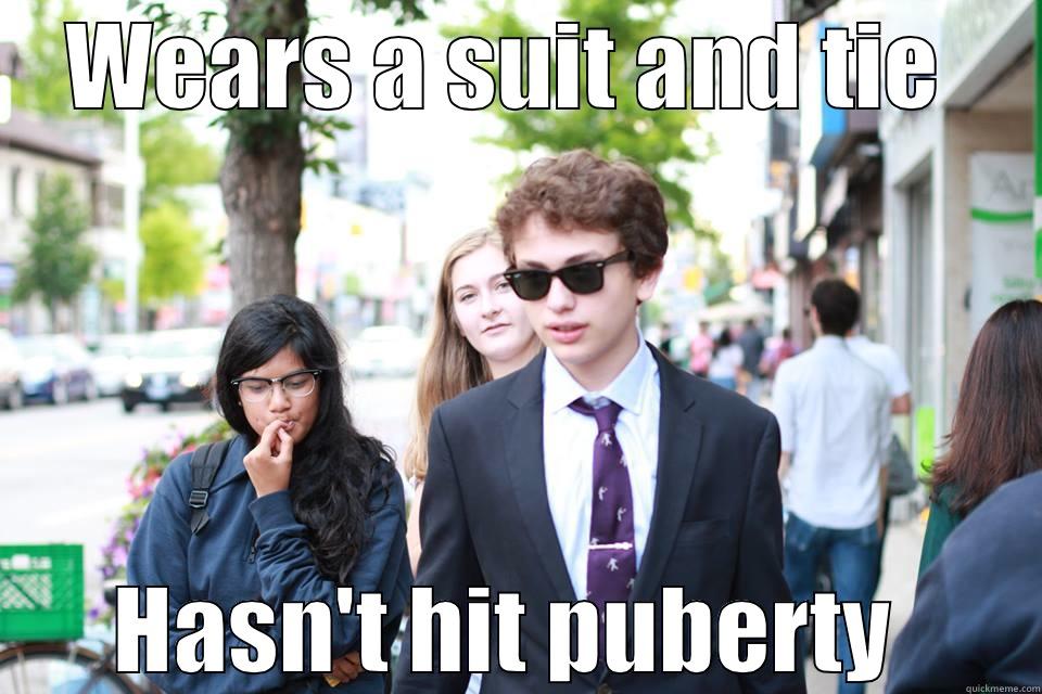 WEARS A SUIT AND TIE  HASN'T HIT PUBERTY  Misc