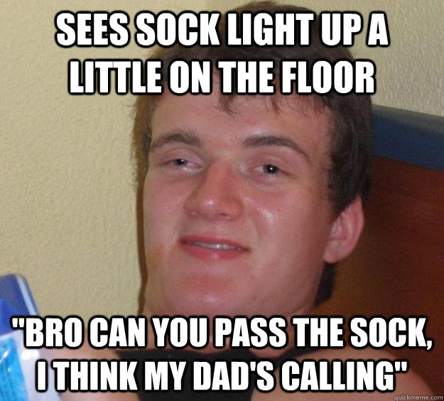 Sees sock light up a little on the floor 