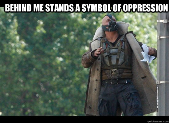 behind me stands a symbol of oppression   