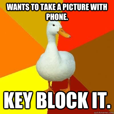 Wants to take a picture with phone. Key block it.  Tech Impaired Duck