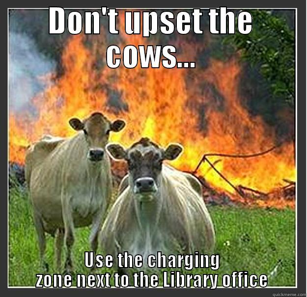 Library cows - DON'T UPSET THE COWS... USE THE CHARGING ZONE NEXT TO THE LIBRARY OFFICE Evil cows