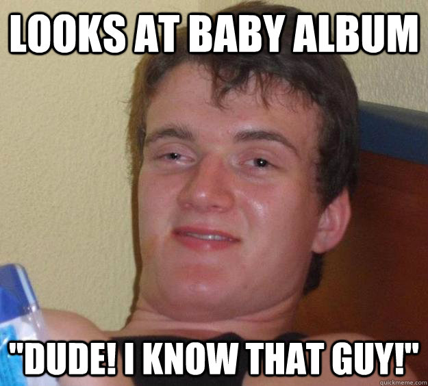 Looks at baby album 