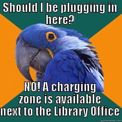 SHOULD I BE PLUGGING IN HERE? NO! A CHARGING ZONE IS AVAILABLE NEXT TO THE LIBRARY OFFICE Paranoid Parrot