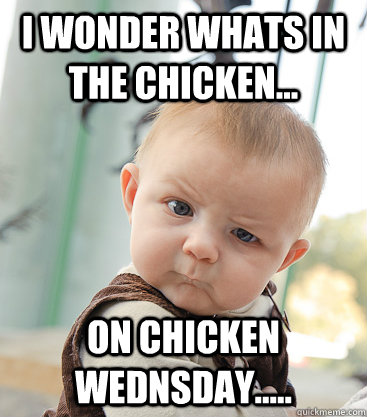 i wonder whats in the chicken... on chicken wednsday.....  skeptical baby