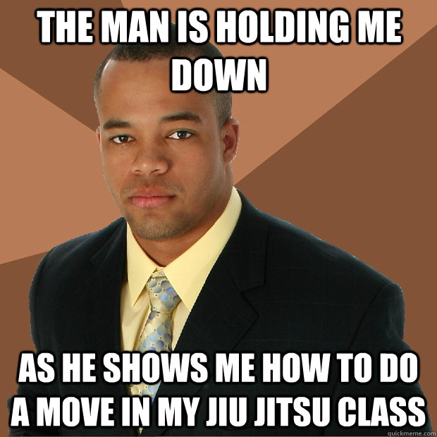 The man is holding me down as he shows me how to do a move in my Jiu Jitsu class - The man is holding me down as he shows me how to do a move in my Jiu Jitsu class  Successful Black Man