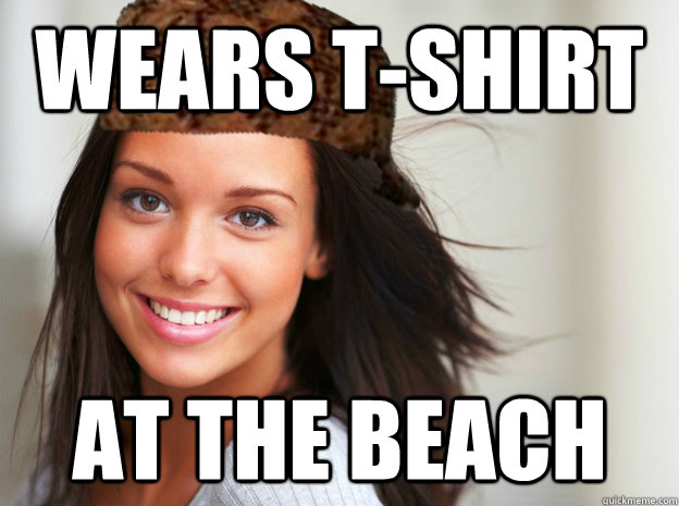 wears t-shirt at the beach  