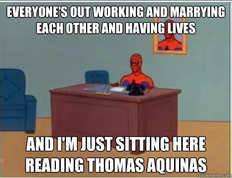 everyone's out working and marrying each other and having lives and I'm just sitting here Reading Thomas Aquinas  Spiderman Desk