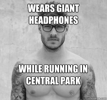 wears giant headphones while running in central park  