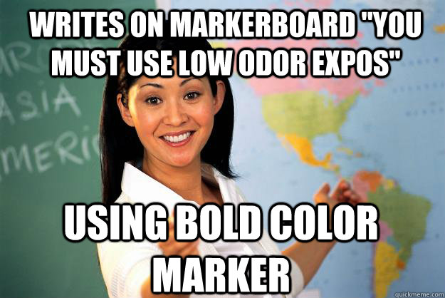 writes on markerboard 