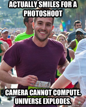 Actually smiles for a photoshoot  Camera cannot compute. Universe explodes.  Ridiculously photogenic guy