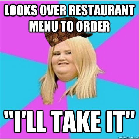 looks over restaurant menu to order 