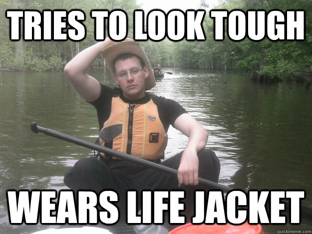 tries to look tough wears life jacket  Canoe Cowboy