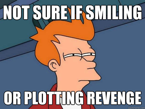 not sure if smiling or plotting revenge  Futurama Fry