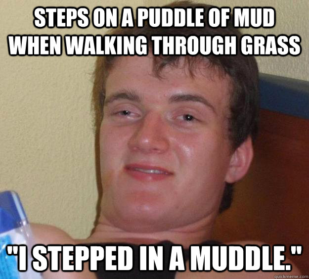 Steps on a puddle of mud when walking through grass 