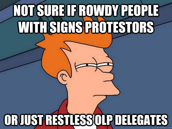 Not sure if rowdy people with signs protestors  Or just restless OLP delegates  - Not sure if rowdy people with signs protestors  Or just restless OLP delegates   Futurama Fry