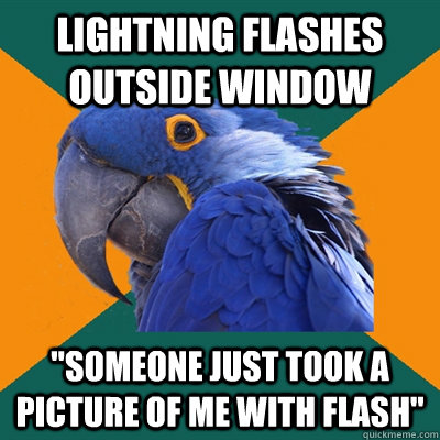 Lightning flashes outside window 